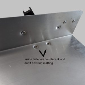 Image of the inside of an aluminum sluice showing flat head countersunk bolts installed so they do not obstruct the internal matting or riffle system.