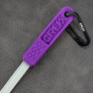 Purple mini CRUX Original Gold Brush with long white bristles for gold prospecting bedrock cleaning.
