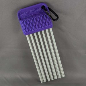 Purple CRUX Original Gold Brush with long white bristles for gold prospecting bedrock cleaning.