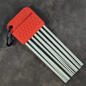 Red CRUX Original Gold Brush with long white bristles for gold prospecting bedrock cleaning.